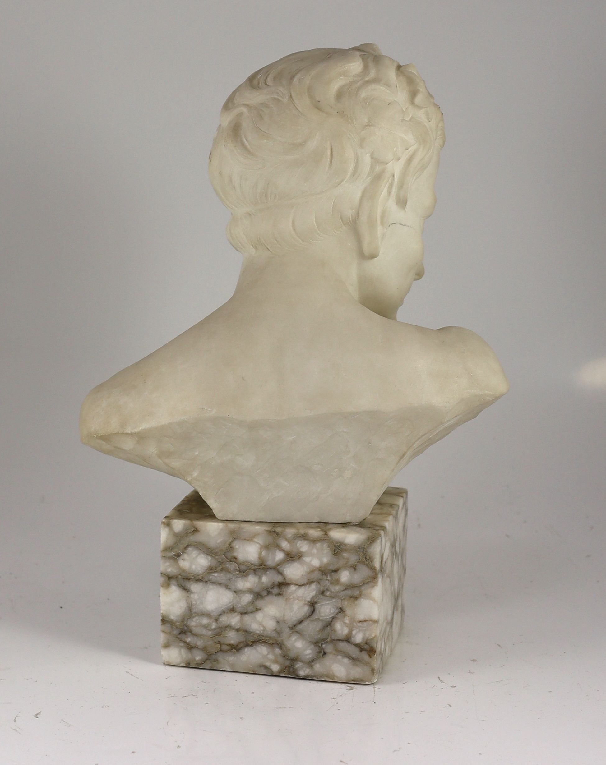An Italian carved white marble bust of a faun, width 28cm height 41cm